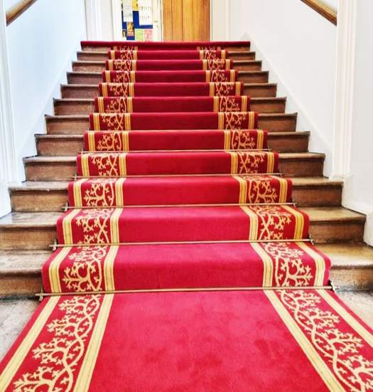Luxurious red carpet adding a regal touch to the entrance