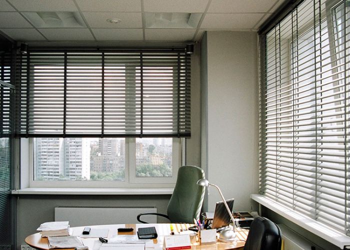 Bright office space featuring aluminum mini blinds