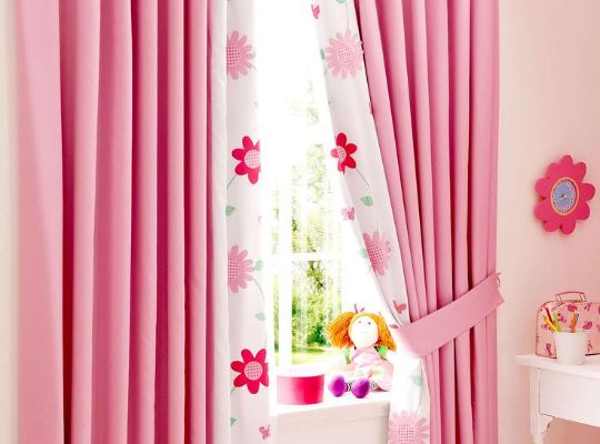 Soft pink curtains with a delicate pattern