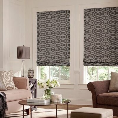 Soft fabric Roman blinds complementing a rustic bedroom