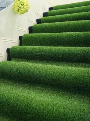 Artificial grass carpet installed on stairs