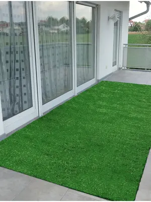 grass carpet used as an area rug on a balcony