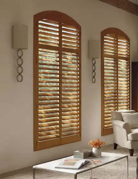 Custom-fit beige window shutters in a cozy Living setting