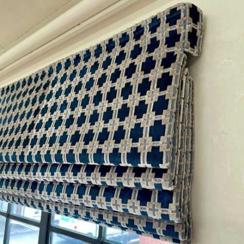 Blue and white patterned roller blinds
