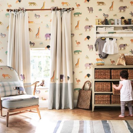 Charming kids' room with playful curtain and plush toys.