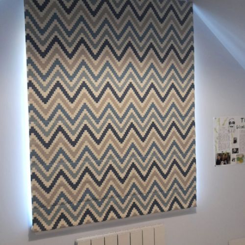 Chevron pattern roller blinds in a room