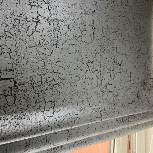 Cracked, textured gray wall