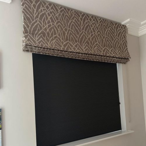 Geometric patterned roller blinds in a room