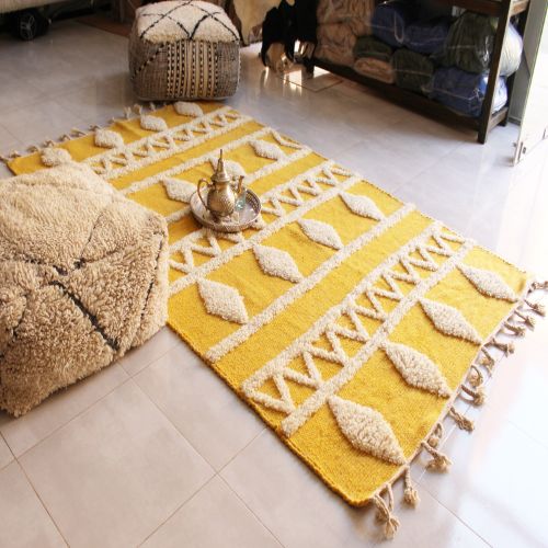 Vivid yellow rug with intricate patterns